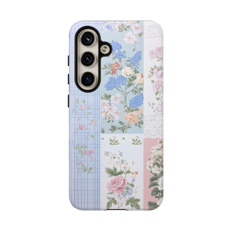 May include: A phone case with a floral pattern. The case is made of a hard plastic and has a clear back. The floral pattern is in shades of pink, blue, and green. The case has a cutout for the camera lens.