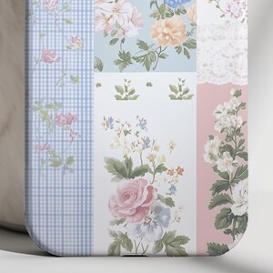 May include: A phone case with a patchwork design featuring floral patterns in shades of pink, blue, and white. The case has a checkered pattern on the left side and a lace pattern on the right side.