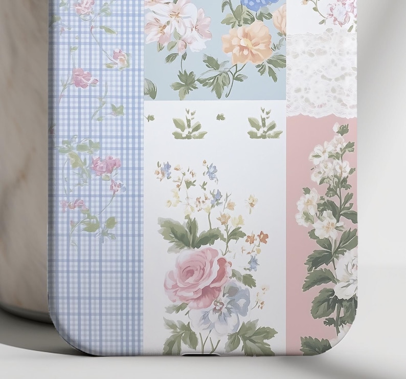May include: A phone case with a patchwork design featuring floral patterns in shades of pink, blue, and white. The case has a checkered pattern on the left side and a lace pattern on the right side.