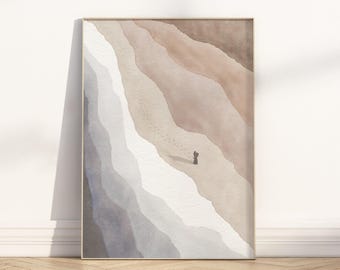 May include: Framed watercolour print showing a beach scene with a figure walking along the shore. The artwork uses soft, muted tones of beige, brown, and grey, creating a serene and minimalist aesthetic. Footprints lead towards the figure.