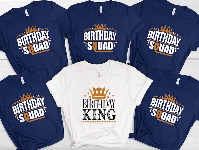 May include: Five navy blue t-shirts with a gold crown and the text "Birthday Squad" and one white t-shirt with a gold crown and the text "Birthday King".