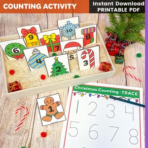May include: A Christmas-themed counting activity set. Features numbered cards with festive images such as baubles, a Christmas tree, and a gingerbread man. A tracing worksheet with numbers 1-8 is also included. Designed for educational play.