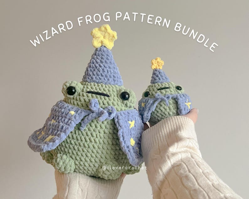 May include: Two crocheted wizard frog plushies, one large and one small, wearing purple and blue hats with yellow stars. The larger frog is wearing a purple and blue cape with yellow stars. The smaller frog is wearing a purple and blue hat with yellow stars. The frogs are both holding a wand. The caption reads "Wizard Frog Pattern Bundle".