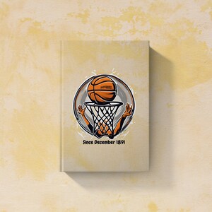 以下が含まれることがあります： バスケットボールがフープを通過し、「Since December 1891」というテキストが書かれた白い本。