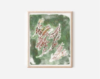 May include: A rectangular framed print featuring a botanical block print design. The artwork displays three stylized leafy branches in shades of reddish-brown and white, set against a textured, mottled forest green background within a light wood frame.