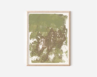 May include: A framed wall art print featuring a textured, abstract botanical illustration in shades of olive green and muted brown. The design displays a layered, stamped appearance with visible brushstrokes and white negative space.