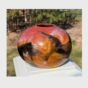 Raku pot, fired in a saggar with soluable salt solution