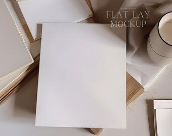 May include: A flat lay mockup featuring a large white square card, surrounded by other white cards and a neutral-toned background. The text "FLAT LAY MOCKUP" is visible in the upper right corner.