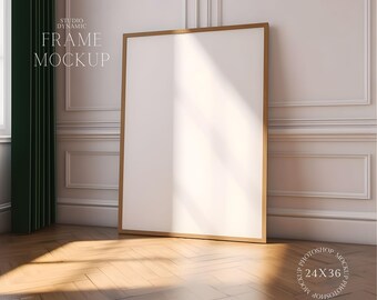 May include: A gold-framed picture mockup in a room with white walls and wood floors. The frame is empty and ready for your design. The text "STUDIO DYNAMIC FRAME MOCKUP" is visible in the upper left corner of the image.