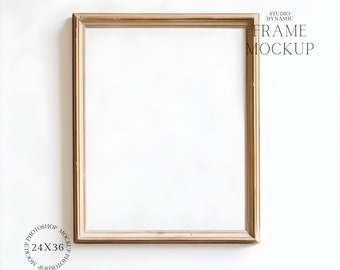 May include: A rectangular, empty picture frame with a gold finish. The frame is 24 x 36 inches and features the text "STUDIO DYNAMIC FRAME MOCKUP" and "24X36 MOCKUP PHOTOSHOP". The frame is set against a white background.