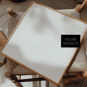 May include: A gold-toned frame mockup on a woven chair with a white background. The text "FRAME MOCKUP" is visible in the center of the frame.