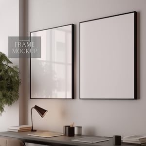 May include: Two black framed pictures hanging on a white wall above a desk with a lamp, books, and a tablet. The text "FRAME MOCKUP" is in the image.