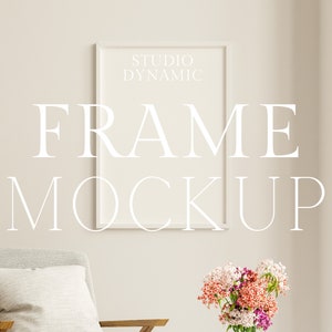 May include: A white frame mockup with the text "STUDIO DYNAMIC FRAME MOCKUP" in a minimalist living room setting with a gray armchair and a bouquet of pink and purple flowers in a glass vase.