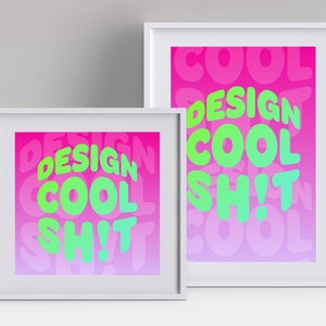 May include: Two framed prints with a pink and purple gradient background. The text "DESIGN COOL SH!T" is written in green and yellow letters on both prints.