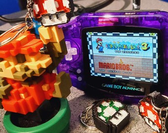 Super Mario Bros. 2-zijdige Super/1-Up Mushroom Voxel-sleutelhanger