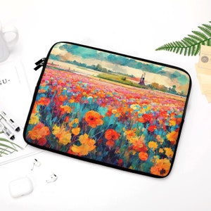 May include: A black laptop sleeve featuring a vibrant watercolor painting of a field of colorful flowers under a cloudy sky. The artwork includes shades of orange, yellow, red, and blue, with a black zipper closure.
