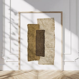 Könnte beinhalten: Abstrakter Kunstdruck mit drei überlappenden Rechtecken aus braunem und beigefarbenem Sackleinen. Der Druck hat eine minimalistische und moderne Ästhetik.
