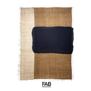 May include: A rectangular piece of fabric with a frayed edge. The fabric is a patchwork of three colors: beige, brown, and dark blue. The dark blue section is a rectangle in the center of the fabric. The fabric has the text "FAB ART&MORE" printed on the bottom.