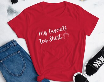 May include: Red short-sleeved t-shirt with white text that reads "My Favorite Tea-Shirt" and a stylized image of a teacup with steam.