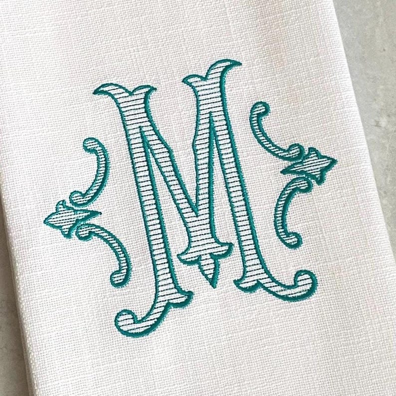 close-up of the striped version of the monogrammed initial personalized dish towel. Choose from solid or stripe monogram embroidery design.