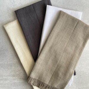 There are four different colors of towels to choose from white cream, charcoal, gray, or khaki (reads green/brown).  each towel is made from 100% cotton has a slub texture and has a fringe end.  In the kitchen on the counter or hanging on the stove.