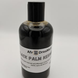 May include: A black bottle of Afr DreaMart Black Palm Kernel Oil. The bottle has a black cap and a white label with text that reads "palm kernel oil | Mianga | Adin Eyan 100% natural African". The bottle contains 250ml of oil.