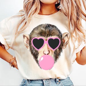 Monkey blowing bubble png Monkey PNG Monkey Mascot Preppy PNG Preppy Mascot PNG black with pink heart glasses Shirt Sublimation