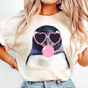 Penguin blowing bubble png Penguin PNG Penguin Mascot Preppy PNG Preppy Mascot PNG black with pink heart glasses Shirt Sublimation