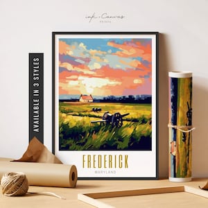 May include: A painting of a sunset over a field with a cannon and a small house in the distance. The text "FREDERICK MARYLAND" is at the bottom of the painting.