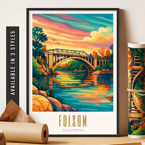 May include: A framed art print of Folsom, California, featuring a colorful bridge over a river at sunset. The artwork is in a vibrant, stylized design with the text "Folsom California" at the bottom. The words "Available in 3 styles" are printed on the side.