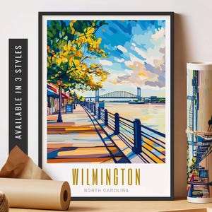May include: A colorful illustration of a waterfront scene in Wilmington, North Carolina. The image features a bridge, a river, trees, and a walkway. The text "WILMINGTON NORTH CAROLINA" is at the bottom of the image.