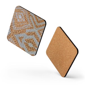 May include: Two diamond-shaped coasters. One has a woven pattern in tan and grey, with a black border. The other is made of cork. These coasters are designed to protect surfaces from drink rings.