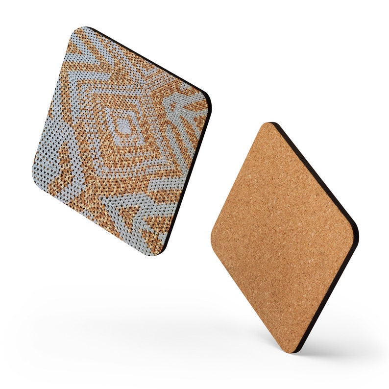 May include: Two square coasters with a black border. One coaster features a woven pattern in shades of tan and light blue. The other coaster is made of cork. The coasters are designed to protect surfaces from heat and moisture.