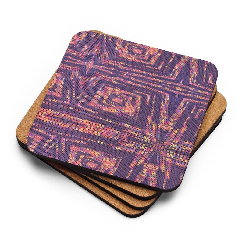 May include: Four square coasters stacked on top of each other. The top coaster has a geometric design in purple, pink, and yellow. The coasters have a cork base. The design is a mosaic of small squares.