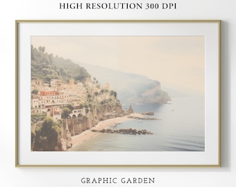 Puede incluir: Una impresión enmarcada de un pueblo costero con edificios en un acantilado, con vistas al mar. La impresión tiene un marco dorado y el texto "HIGH RESOLUTION 300 DPI" y "GRAPHIC GARDEN PRINT SHOP". La imagen tiene una paleta de colores suaves y vintage.