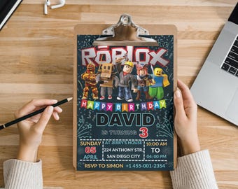 May include: A colorful Roblox birthday party invitation with a chalkboard background. The invitation features a group of Roblox characters, the name David, and the text "Happy Birthday David is turning 3". The invitation also includes the date, time, and location of the party.