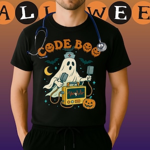 May include: Black t-shirt with a Halloween-themed graphic. The design features a ghost wearing a nurse's cap, holding medical devices, and a yellow medical device. The text "CODE BOO" is above the ghost. A stethoscope is draped around the neck.