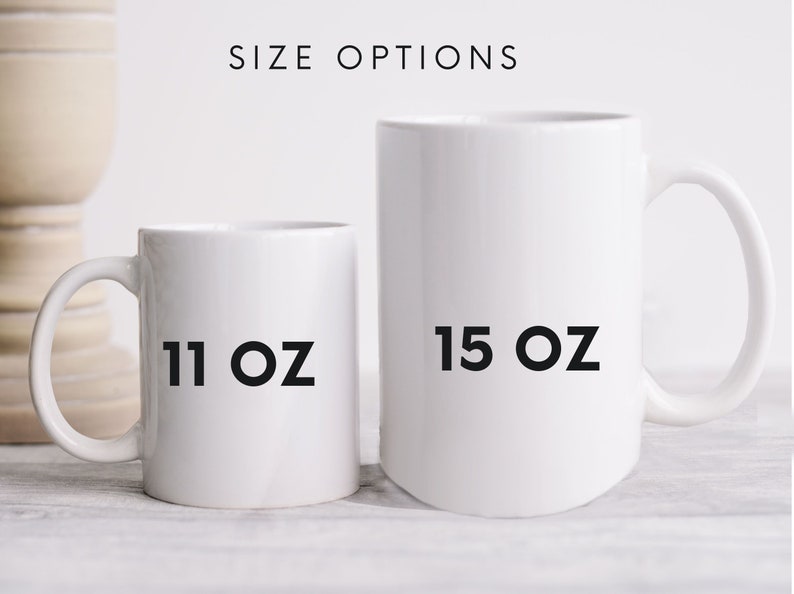 May include: Two white ceramic mugs, one 11 oz and one 15 oz, on a light wood surface.  The mugs are empty and ready to be filled with your favorite beverage.
