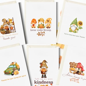 May include: Six different greeting cards featuring illustrations of gnomes and autumnal themes. The cards have various messages, including "You're 'Oourd-geous' Thank you!" and "Gnome-vember blessings."