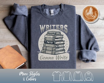 May include: A navy blue sweatshirt with the text "Writers Gonna Write" and a graphic of a stack of books. The books have titles like "Thriller," "Poetry," and "Horror." Additional shirt styles and colors are shown at the bottom.