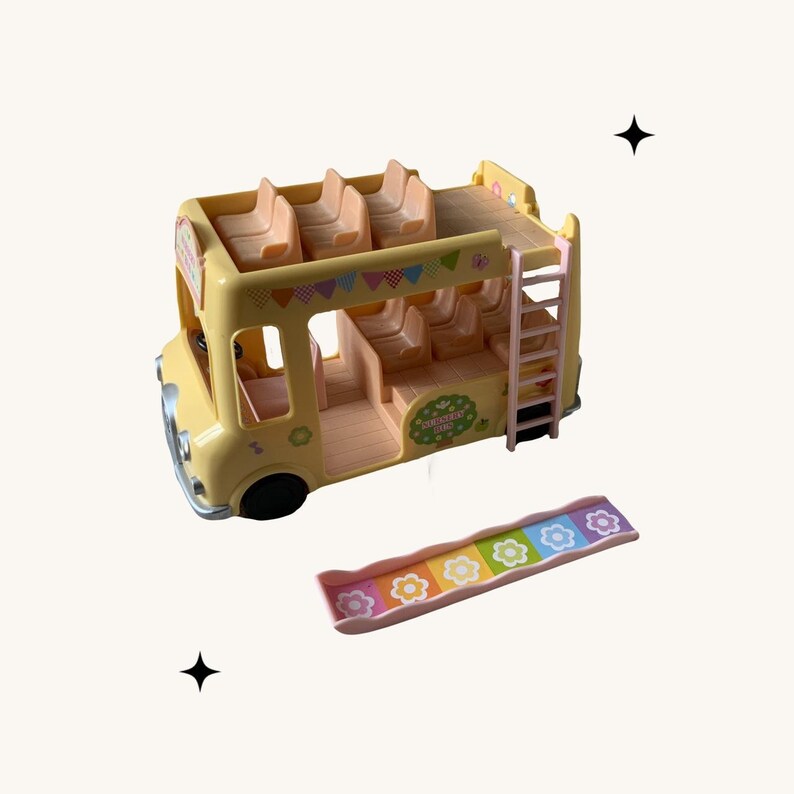 May include: A yellow double-decker bus toy with a pink ladder and a pink slide with rainbow accents. The bus has a sign that says "Strawberry Farm" and has a pink roof with a brown top.