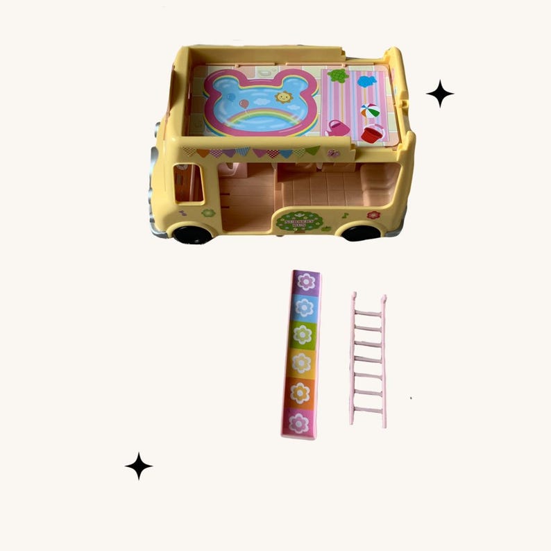 May include: A yellow toy bus with a pink roof and a bear face on the top. The bus has a slide and a ladder that are also included.