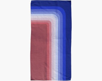 May include: A red, white, and blue striped beach towel with a curved design. The towel is made of soft, absorbent fabric and is perfect for drying off after a swim.