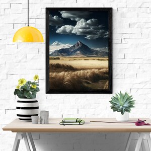 Field with view of mountains and clouds.