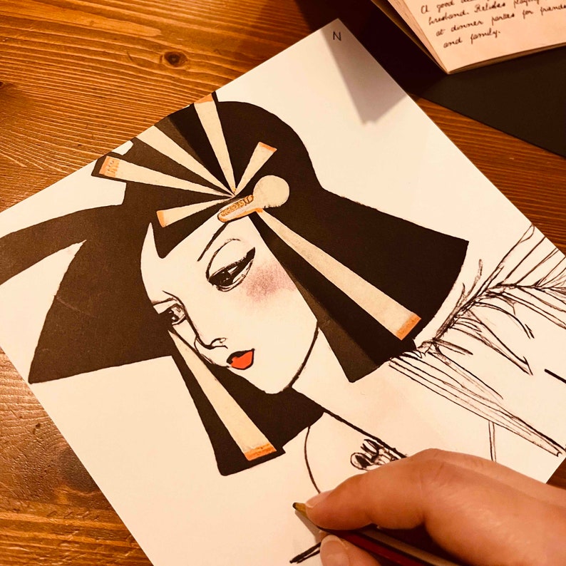 May include: A black and white illustration of a woman with a large, elaborate headdress. The woman has a long, flowing black wig and a delicate, feminine face. The headdress is made of a series of black and white feathers and a gold band.