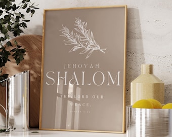 May include: A framed print with the words "JEHOVAH SHALOM" and a sprig illustration. The print is in a gold frame and has a neutral color palette. A decorative vase and a metal bowl with lemons are also visible.