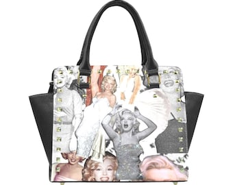 May include: A black handbag with gold studs and a white print featuring a collage of images of Marilyn Monroe.