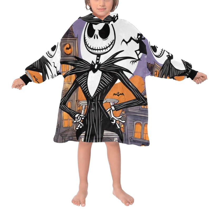 May include: A white hooded blanket with a colorful print of Jack Skellington from The Nightmare Before Christmas. The blanket has long sleeves and a large hood.
