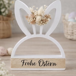 Könnte beinhalten: Ein Set aus drei Keramikbechern mit gesprenkelter, matter Oberfläche. Die Becher sind in Creme-, Hellgrau- und Dunkelgrautönen gehalten. Jeder Becher hat ein schlichtes, minimalistisches Design, perfekt für Kaffee oder Tee.