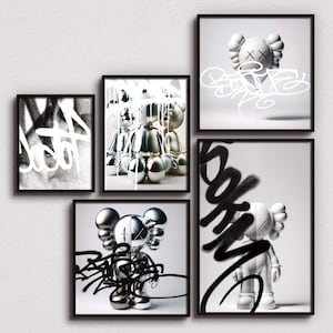 May include: Four framed black and white prints of a silver and white sculpture of a cartoon character with the word "SOOK" spray painted in black on the bottom right print.